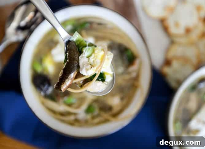 Chicken + Mushroom Noodle Soup with Poached Eggs I howsweeteats.com Chicken + Mushroom Noodle Soup with Poached Eggs I howsweeteats.com