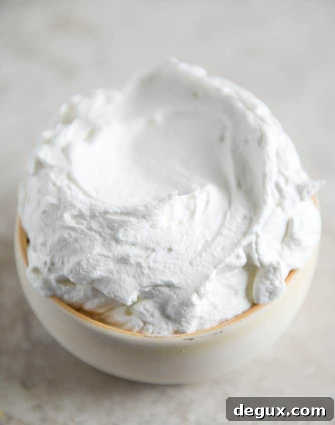 Dark Chocolate Chunk Popovers with Spiked Vanilla Bourbon Whipped Cream I howsweeteats.com Dark Chocolate Chunk Popovers with Spiked Vanilla Bourbon Whipped Cream I howsweeteats.com