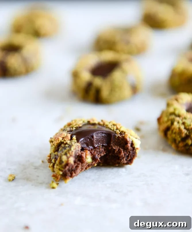 Chocolate Fudge Pistachio Thumbprints I howsweeteats.com