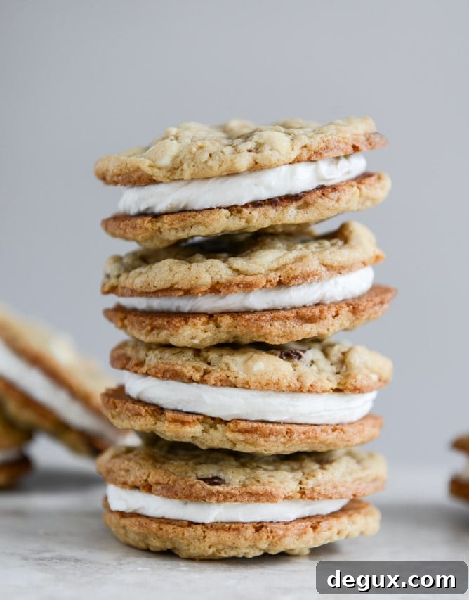 Chewy Black + White Chip Oatmeal Sandwich Cookies with Marshmallow Buttercream Filling I howsweeteats.com Chewy Black + White Chip Oatmeal Sandwich Cookies with Marshmallow Buttercream Filling I howsweeteats.com