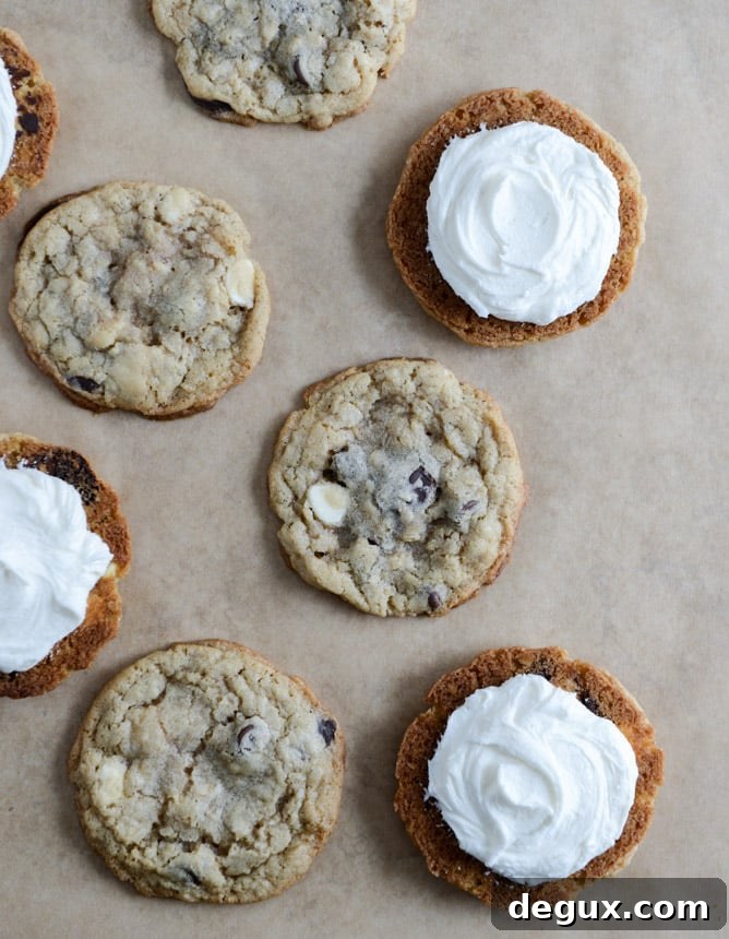 Chewy Black + White Chip Oatmeal Sandwich Cookies with Marshmallow Buttercream Filling I howsweeteats.com Chewy Black + White Chip Oatmeal Sandwich Cookies with Marshmallow Buttercream Filling I howsweeteats.com