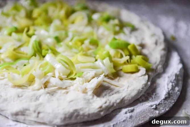 Pulled Pork Pizza with Maple Leeks, Roasted Garlic and Aged Cheddar