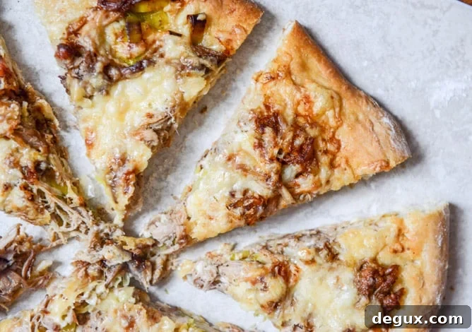 Pulled Pork Pizza with Maple Leeks, Roasted Garlic and Aged Cheddar