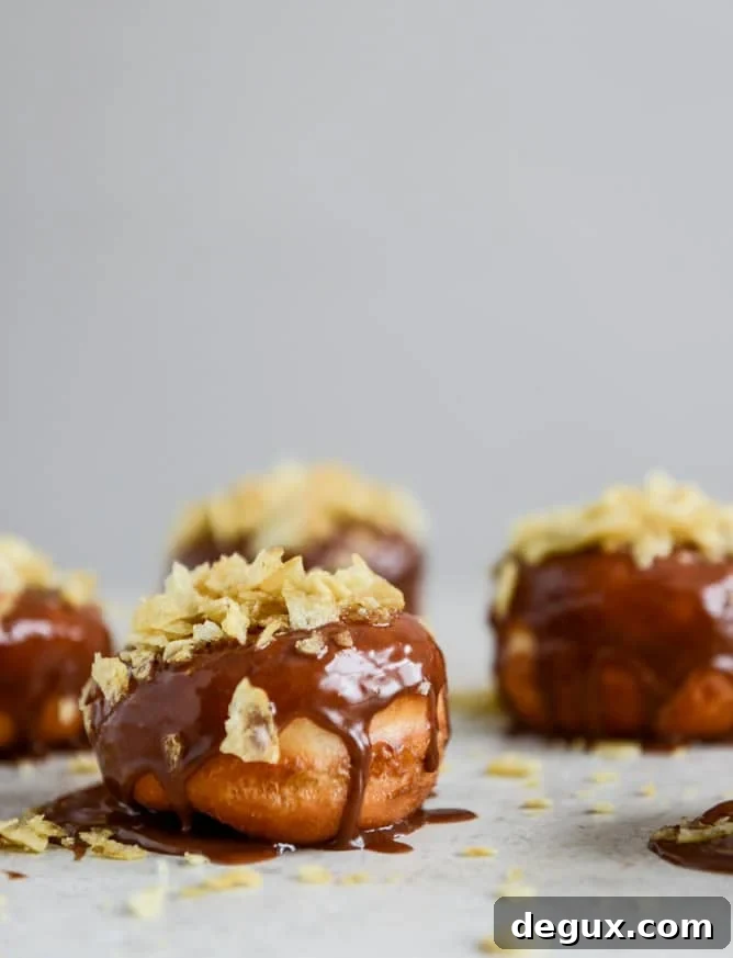 Crunchy Kettle Chip Chocolate Frosted Raised Donuts I howsweeteats.com Crunchy Kettle Chip Chocolate Frosted Raised Donuts I howsweeteats.com