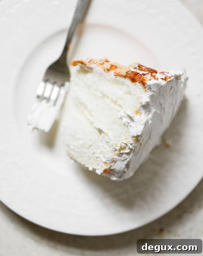 Angel Food Layer Cake with Whipped Coconut Cream and Grapefruit Syrup I howsweeteats.com Angel Food Layer Cake with Whipped Coconut Cream and Grapefruit Syrup I howsweeteats.com