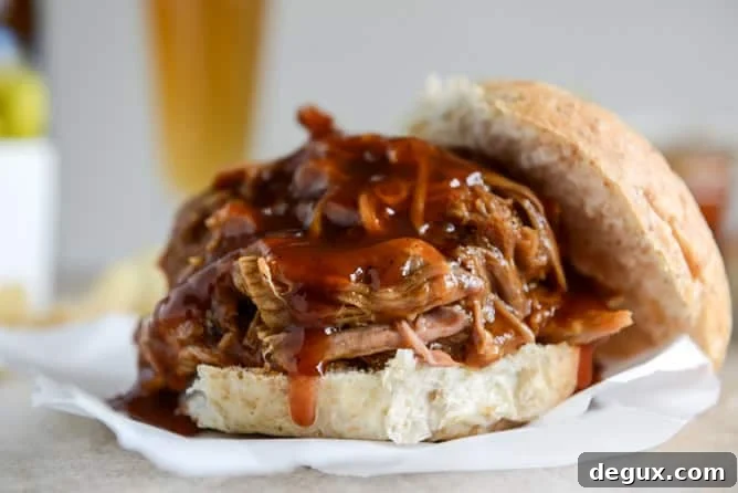 Juicy Pulled Pork Sandwich Recipe with Tangy BBQ Sauce 5 saucy pulled pork sandwiches I howsweeteats.com