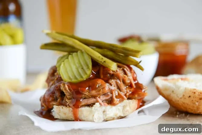 Juicy Pulled Pork Sandwich Recipe with Tangy BBQ Sauce 7 saucy pulled pork sandwiches I howsweeteats.com