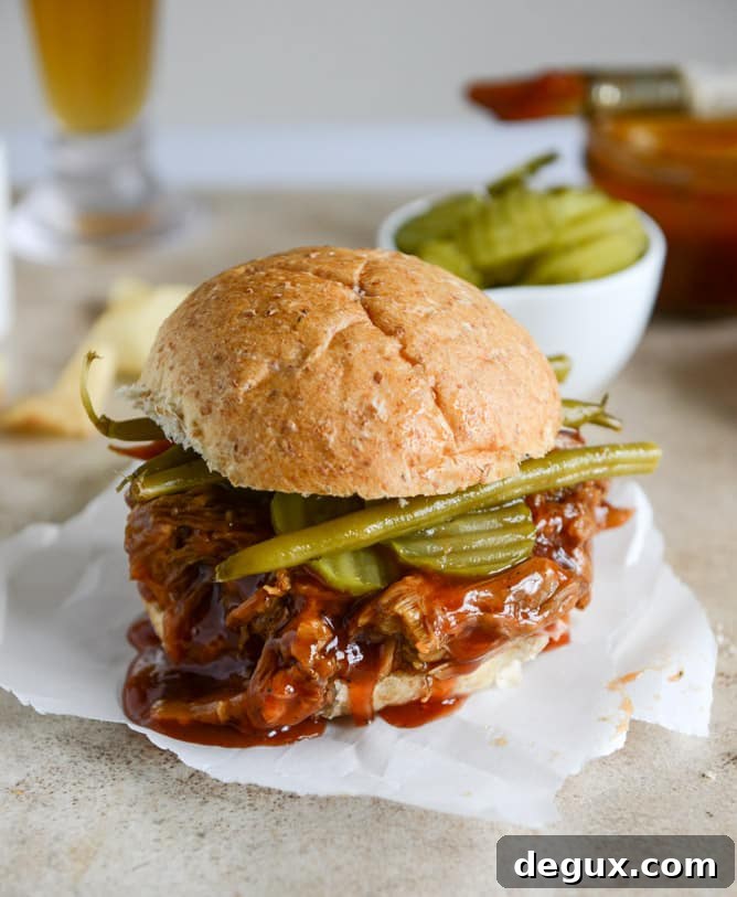 Juicy Pulled Pork Sandwich Recipe with Tangy BBQ Sauce 9 saucy pulled pork sandwiches I howsweeteats.com