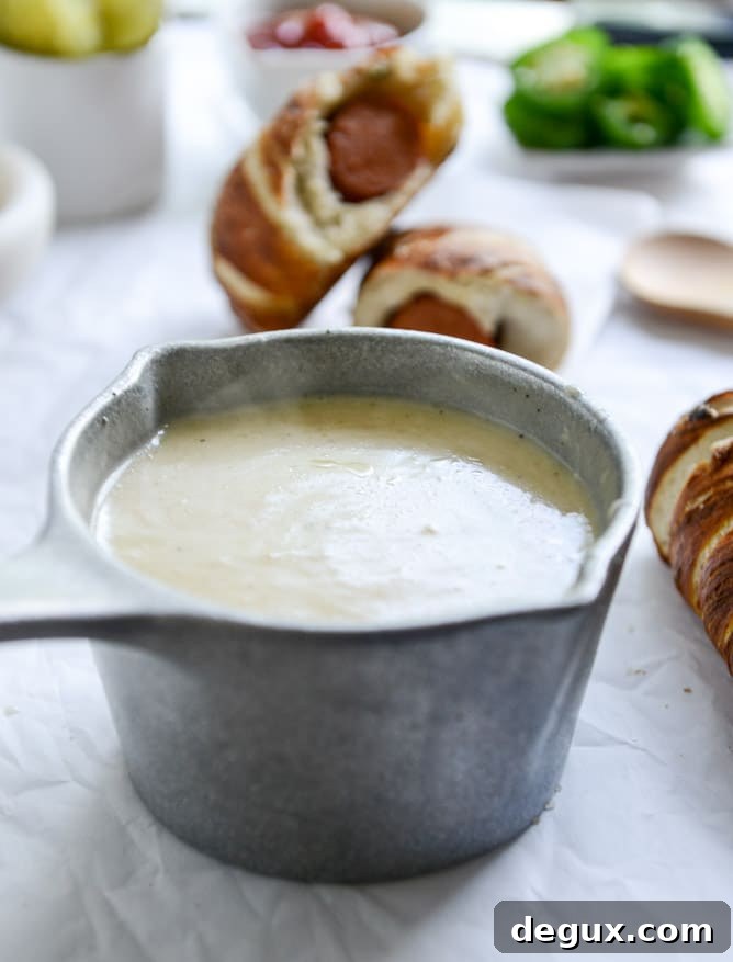 Jalapeño Pretzel Dogs with Cheddar Beer Sauce