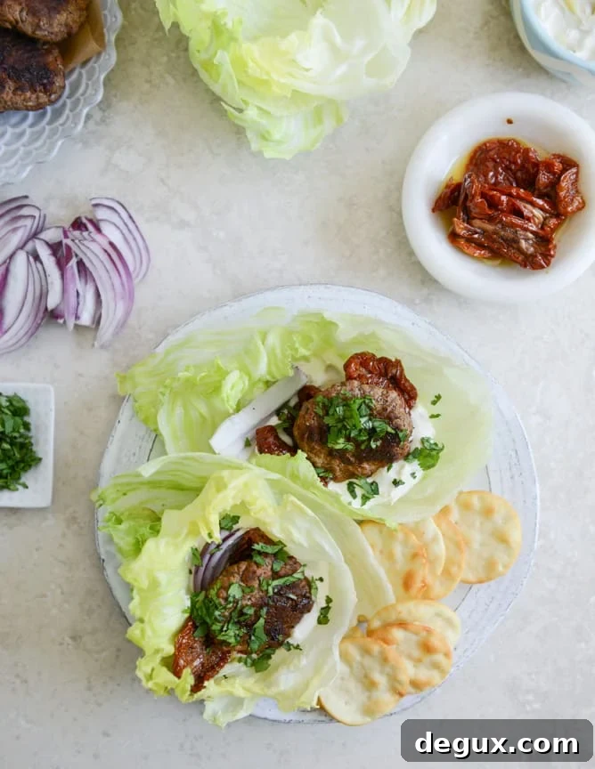 Lamb Slider Lettuce Wraps with Whipped Feta Spread Recipe 2 lamb slider lettuce wraps with whipped feta, artichokes and sun dried tomatoes I howsweeteats.com