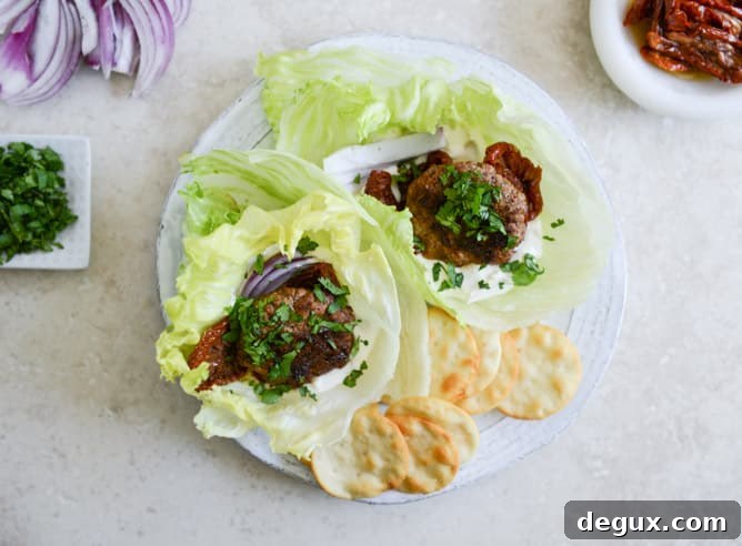 Lamb Slider Lettuce Wraps with Whipped Feta Spread Recipe 5 lamb slider lettuce wraps with whipped feta, artichokes and sun dried tomatoes I howsweeteats.com