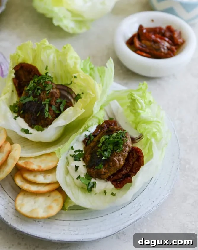 Lamb Slider Lettuce Wraps with Whipped Feta Spread Recipe 7 lamb slider lettuce wraps with whipped feta, artichokes and sun dried tomatoes I howsweeteats.com