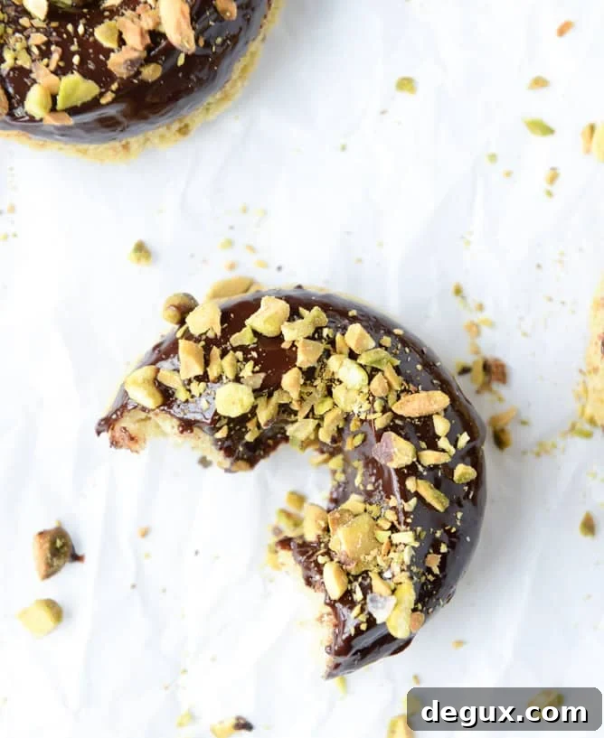 chocolate fudge pistachio cake donuts I howsweeteats.com