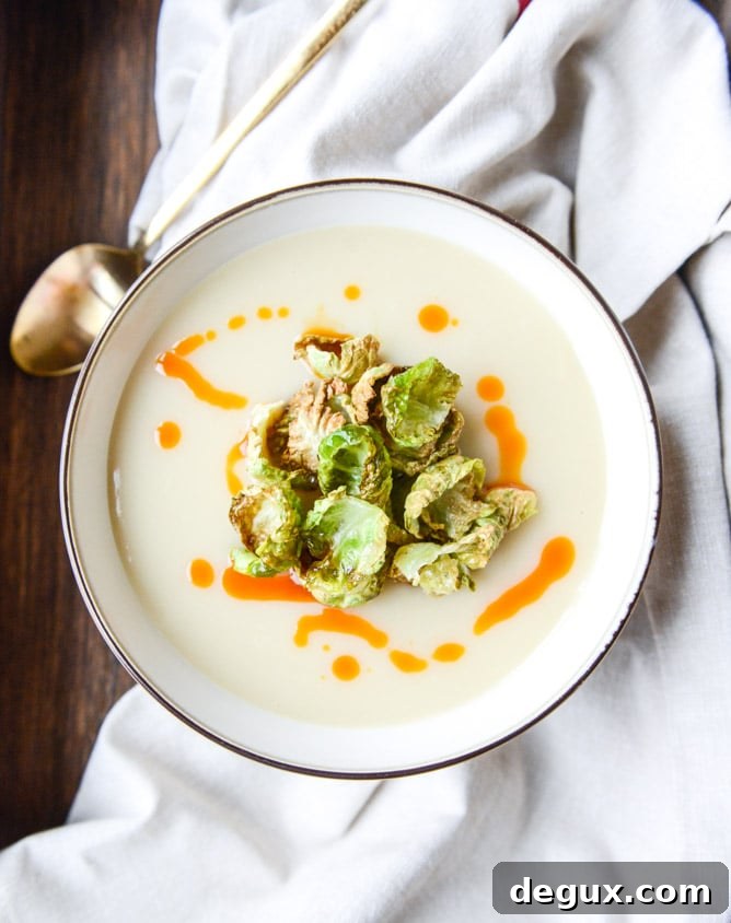 creamy roasted garlic potato soup with crispy brussels I howsweeteats.com