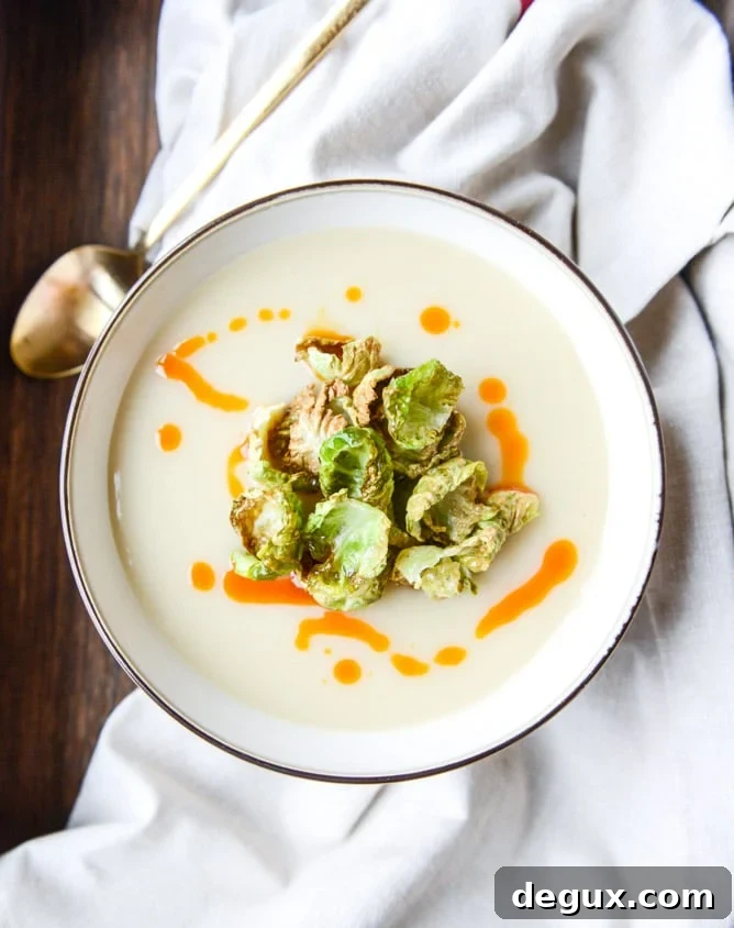 Creamy Roasted Garlic Potato Soup with Crispy Brussels & Chili Oil 2 creamy roasted garlic potato soup with crispy brussels I howsweeteats.com