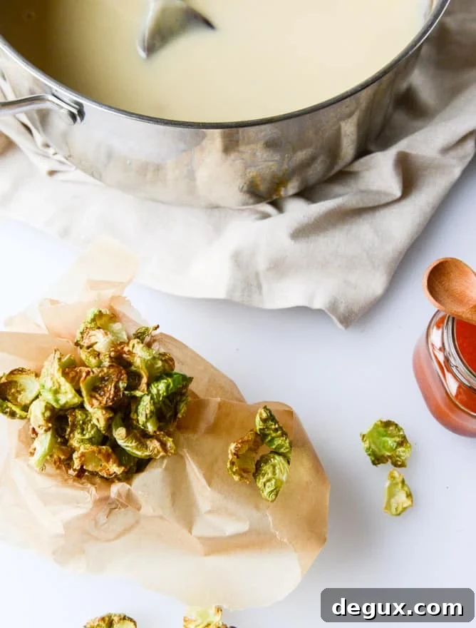 Creamy Roasted Garlic Potato Soup with Crispy Brussels & Chili Oil 3 creamy roasted garlic potato soup with crispy brussels I howsweeteats.com