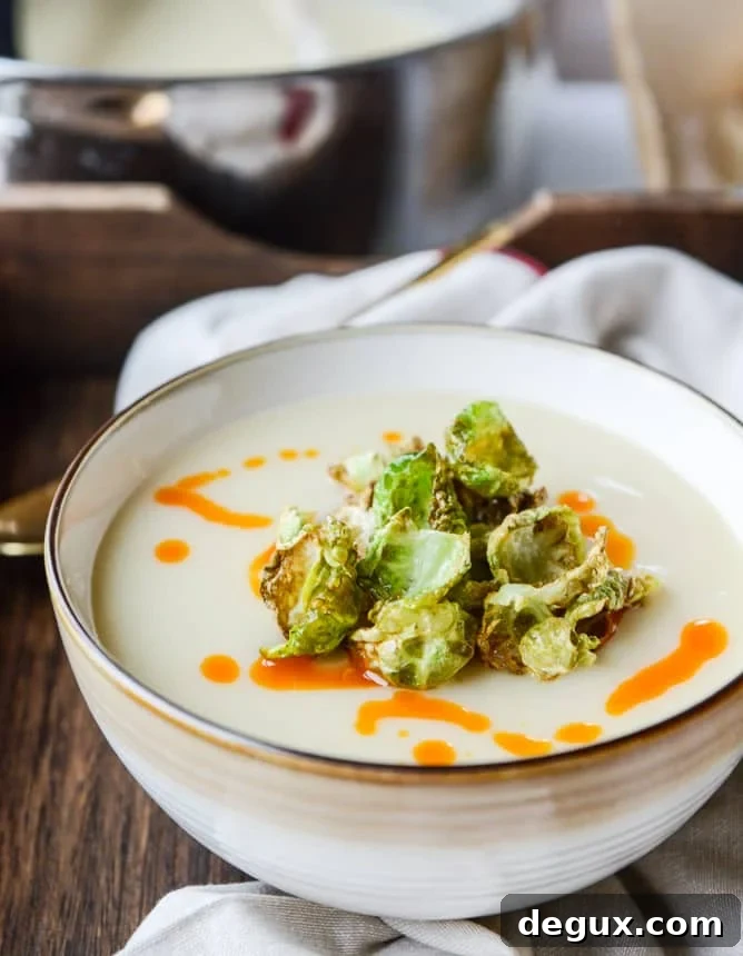 Creamy Roasted Garlic Potato Soup with Crispy Brussels & Chili Oil 4 creamy roasted garlic potato soup with crispy brussels I howsweeteats.com