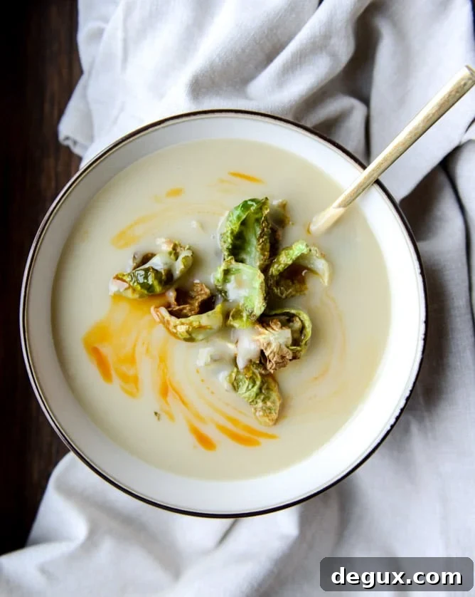 creamy roasted garlic potato soup with crispy brussels I howsweeteats.com