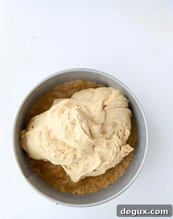 peanut butter cheesecake with whipped marshmallow and bananas I howsweeteats.com