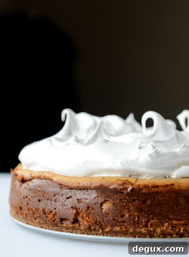 peanut butter cheesecake with whipped marshmallow and bananas I howsweeteats.com