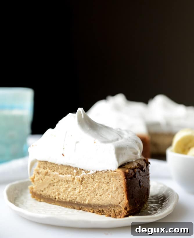peanut butter cheesecake with whipped marshmallow and bananas I howsweeteats.com