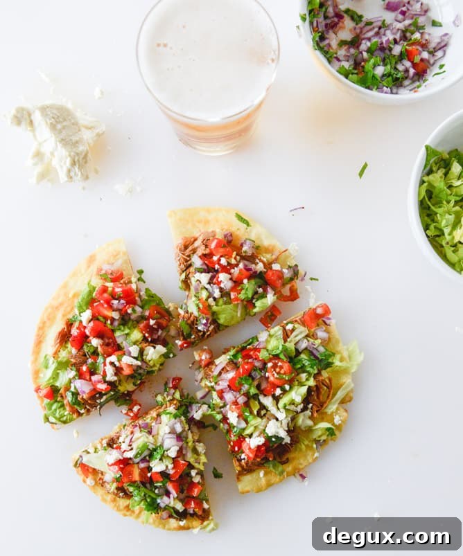 Crispy Pulled Pork Tostadas with Tangy Slaw and Avocado 2 pulled pork tostadas I howsweeteats.com