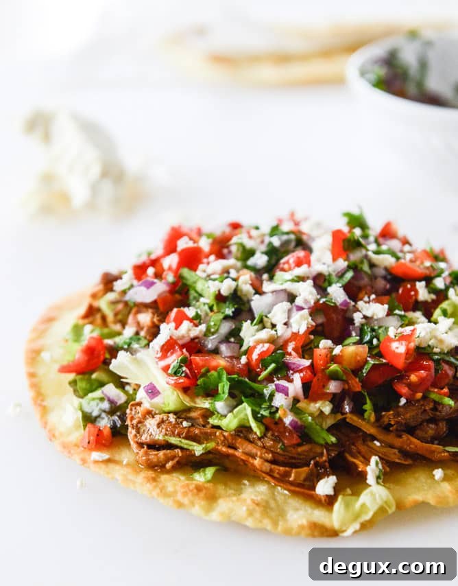 Crispy Pulled Pork Tostadas with Tangy Slaw and Avocado 5 pulled pork tostadas I howsweeteats.com