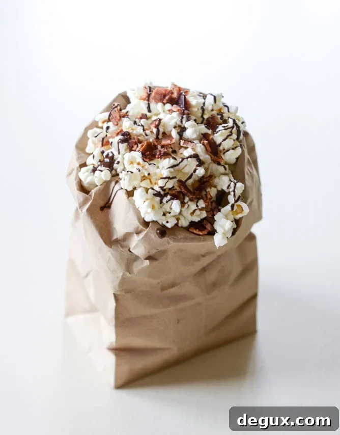 Spicy Bacon Popcorn with Lindt Chocolate Drizzle 2 hot pepper bacon popcorn with a chocolate drizzle I howsweeteats.com