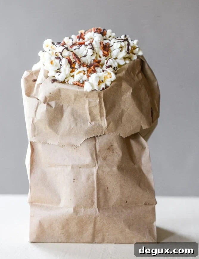 Spicy Bacon Popcorn with Lindt Chocolate Drizzle 10 hot pepper bacon popcorn with a chocolate drizzle I howsweeteats.com