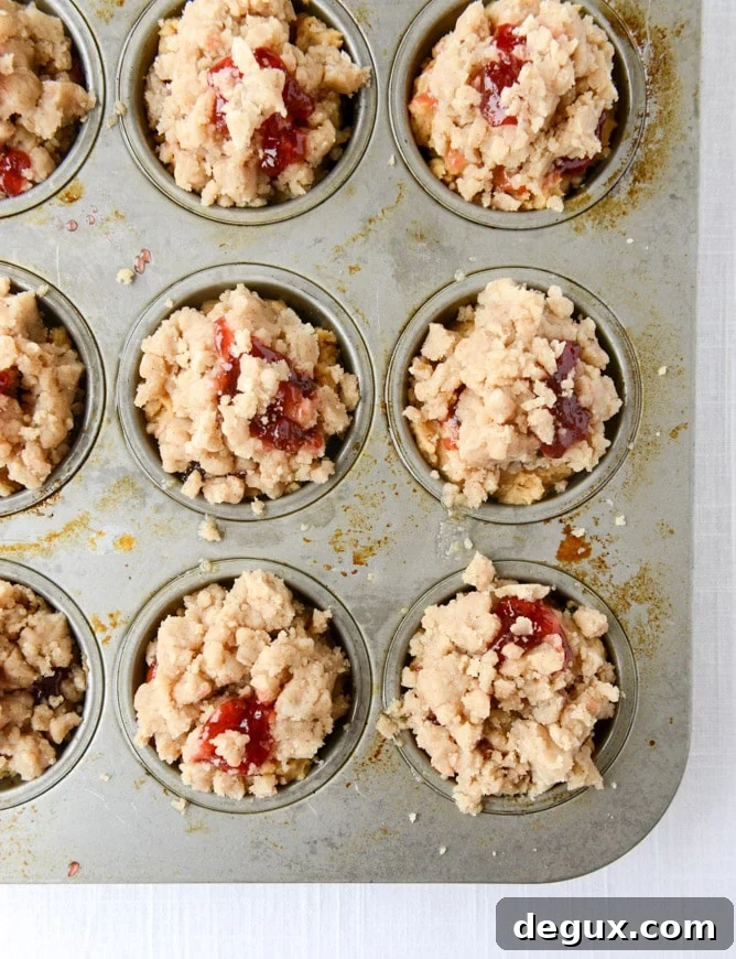 Peanut Butter & Jelly Crumb Muffins Recipe for Homemade Snacks 5 peanut butter and jelly crumb muffins I howsweeteats.com