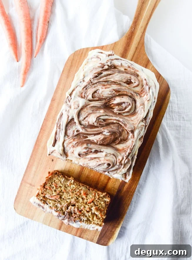 carrot cake cake with nutella swirled cream cheese frosting I howsweeteats.com