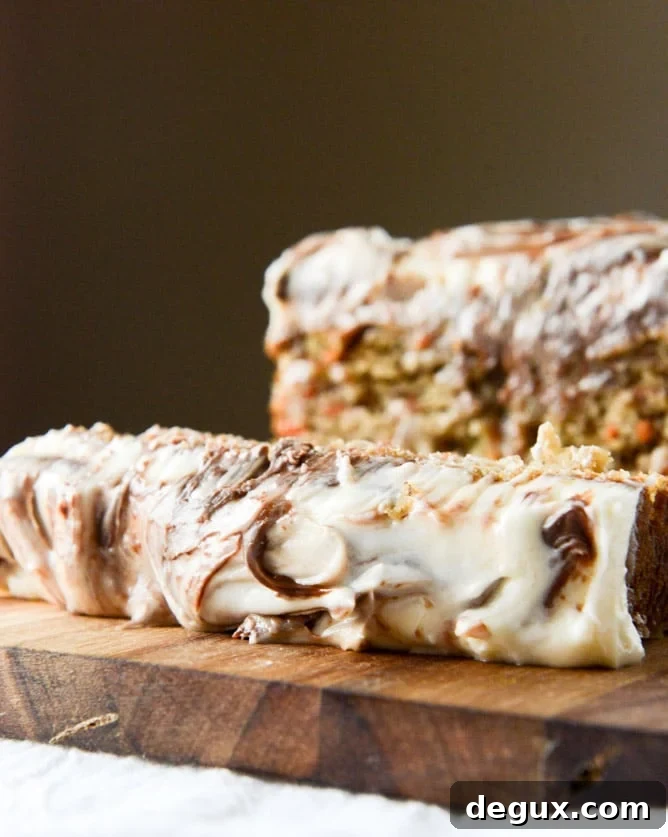 carrot cake cake with nutella swirled cream cheese frosting I howsweeteats.com