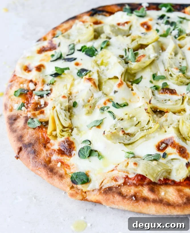 30-Minute Cheesy Artichoke Skillet Flatbread Recipe 2 30 Minute Cheesy Artichoke Skillet Flatbread I howsweeteats.com