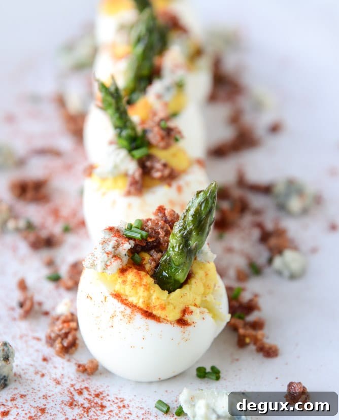 bacon blue deviled eggs with roasted garlic and asparagus I howsweeteats.com