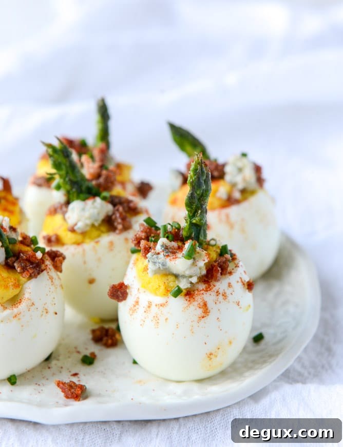 bacon blue deviled eggs with roasted garlic and asparagus I howsweeteats.com