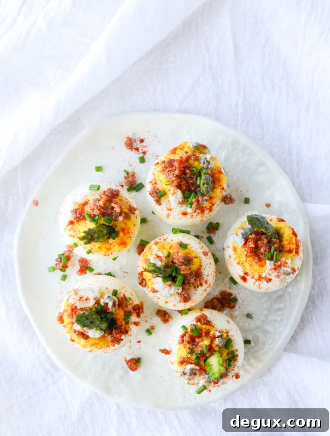 bacon blue deviled eggs with roasted garlic and asparagus I howsweeteats.com