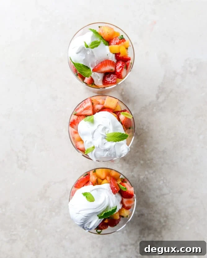 strawberry mango mint julep fruit salad with whipped marshmallow I howsweeteats.com