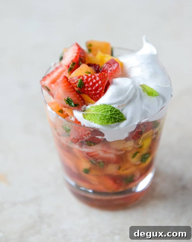 strawberry mango mint julep fruit salad with whipped marshmallow I howsweeteats.com