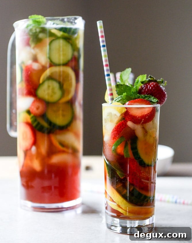 Strawberry Pimm's Cup Cocktail Recipe for Summer Gatherings 2 strawberry pimm's cups I howsweeteats.com