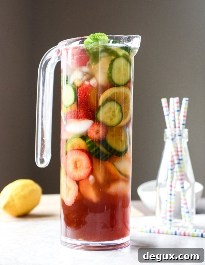 Strawberry Pimm's Cup Cocktail Recipe for Summer Gatherings 7 strawberry pimm's cups I howsweeteats.com