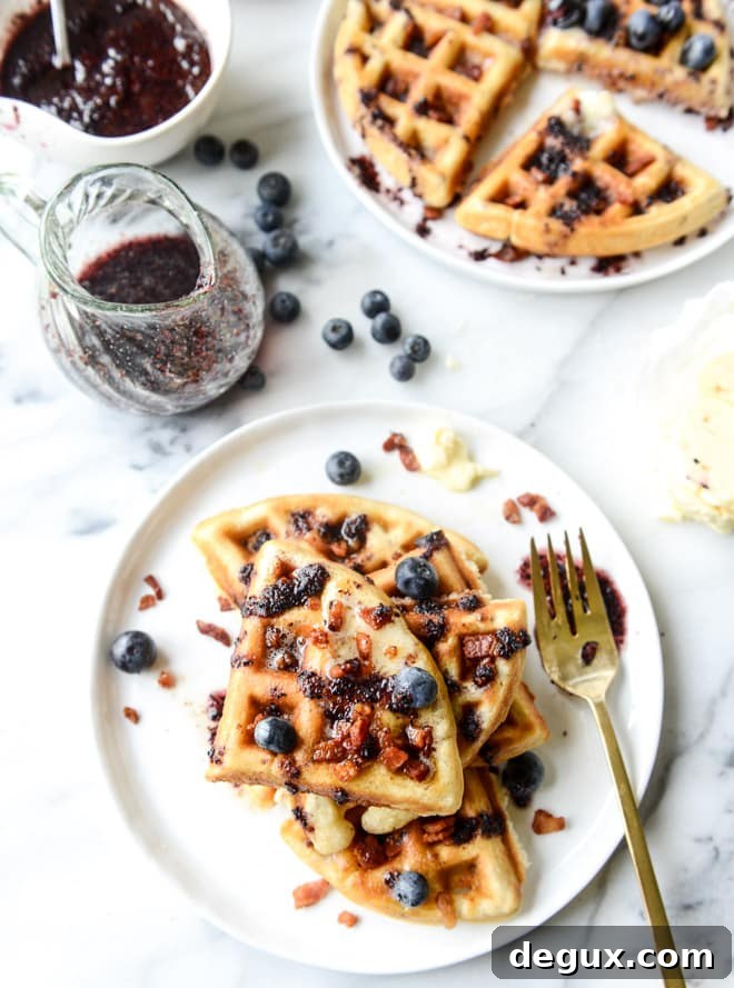 Bourbon Butter Bacon Waffles with Blueberry Syrup 2 crispy bacon waffles with bourbon butter + blueberry syrup I howsweeteats.com