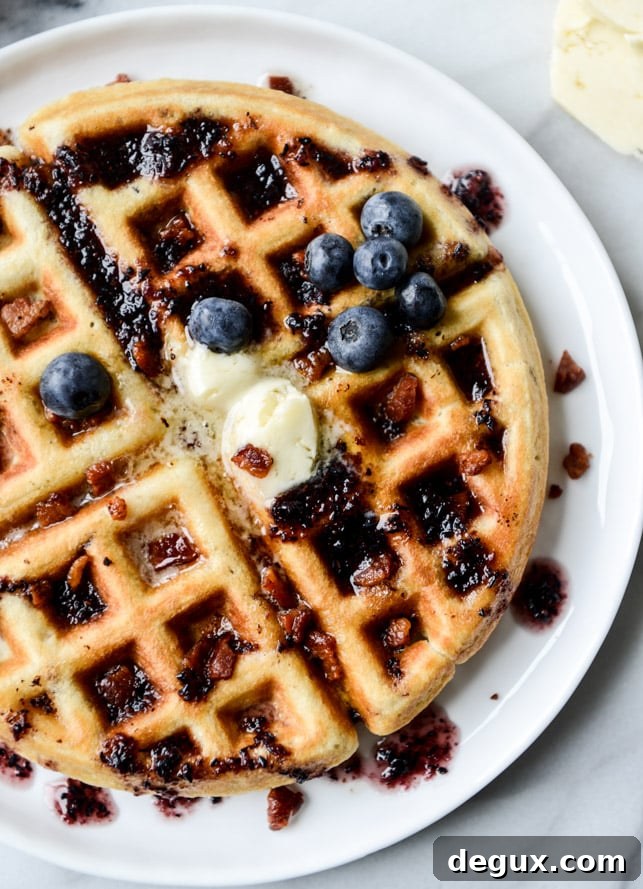 Bourbon Butter Bacon Waffles with Blueberry Syrup 4 crispy bacon waffles with bourbon butter + blueberry syrup I howsweeteats.com