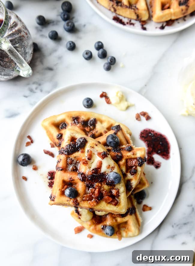 Bourbon Butter Bacon Waffles with Blueberry Syrup 6 crispy bacon waffles with bourbon butter + blueberry syrup I howsweeteats.com