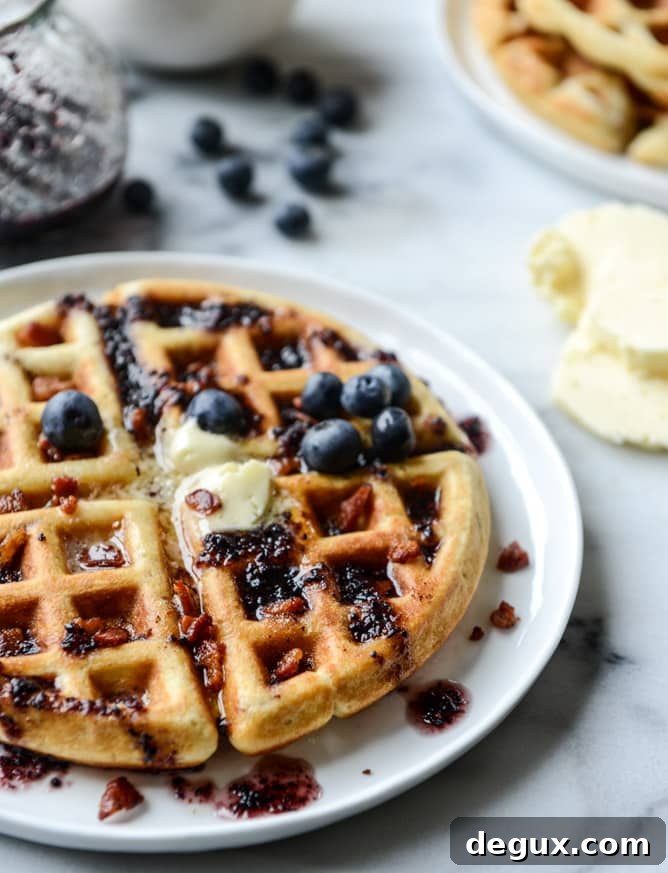 Bourbon Butter Bacon Waffles with Blueberry Syrup 8 crispy bacon waffles with bourbon butter + blueberry syrup I howsweeteats.com