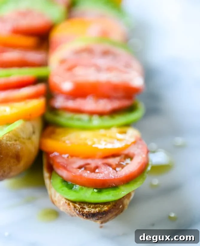 Heirloom Tomato, Avocado & Burrata Salad on Grilled Garlic Toast 5 heirloom tomato, avocado and burrata grilled garlic toast I howsweeteats.com