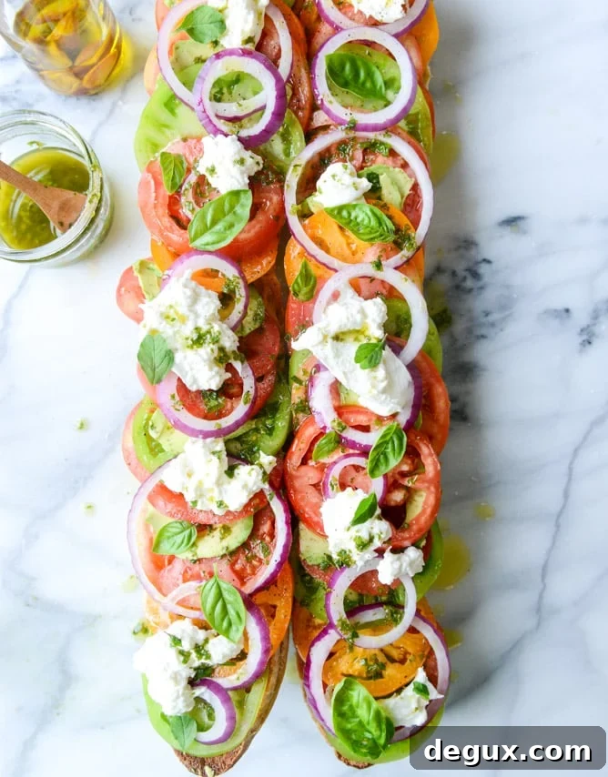 Heirloom Tomato, Avocado & Burrata Salad on Grilled Garlic Toast 7 heirloom tomato, avocado and burrata grilled garlic toast I howsweeteats.com