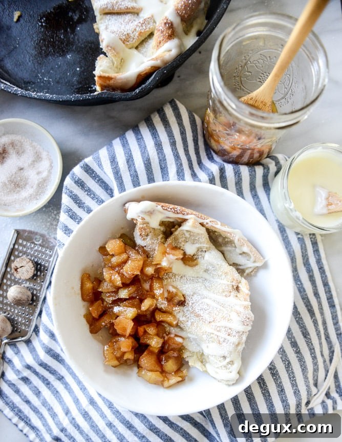 Vanilla Cinnamon Roll Dutch Baby with Apple Bourbon Compote & Cream Cheese Icing 6 vanilla cinnamon roll dutch baby with apple bourbon compote and cream cheese icing I howsweeteats.com