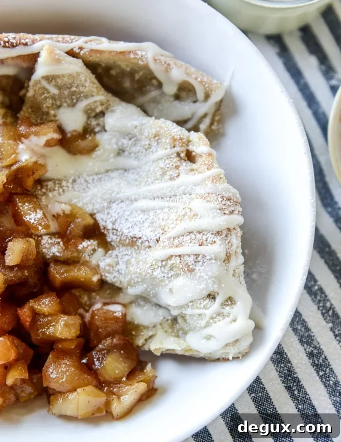 Vanilla Cinnamon Roll Dutch Baby with Apple Bourbon Compote & Cream Cheese Icing 7 vanilla cinnamon roll dutch baby with apple bourbon compote and cream cheese icing I howsweeteats.com