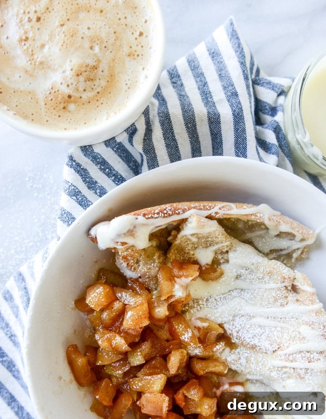 Vanilla Cinnamon Roll Dutch Baby with Apple Bourbon Compote & Cream Cheese Icing 10 vanilla cinnamon roll dutch baby with apple bourbon compote and cream cheese icing I howsweeteats.com