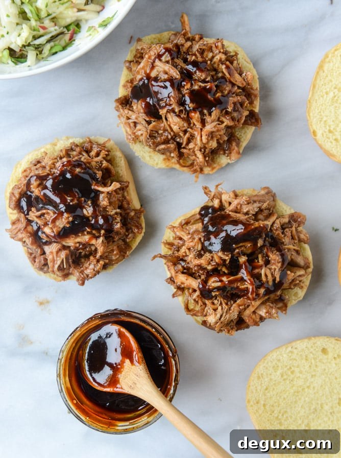 Pomegranate BBQ Chicken Sandwiches with Crunchy Apple Slaw 6 saucy chicken sandwiches with pomegranate bbq sauce and crunchy apple slaw I howsweeteats.com